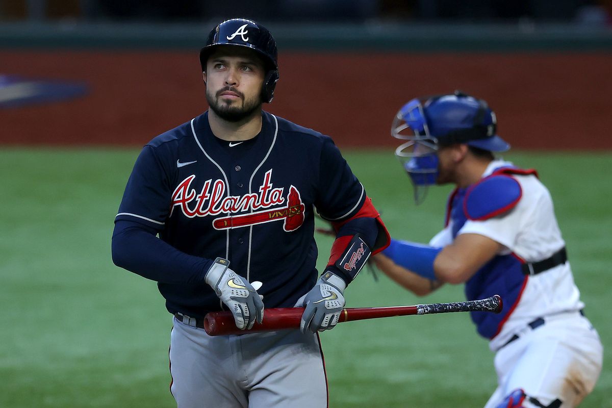 Travis d’Arnaud #16 of the Atlanta Braves reacts after striking out against the Los Angeles Dodgers during the eighth inning in Game Six of the National League Championship Series at Globe Life Field on October 17, 2020 in Arlington, Texas.