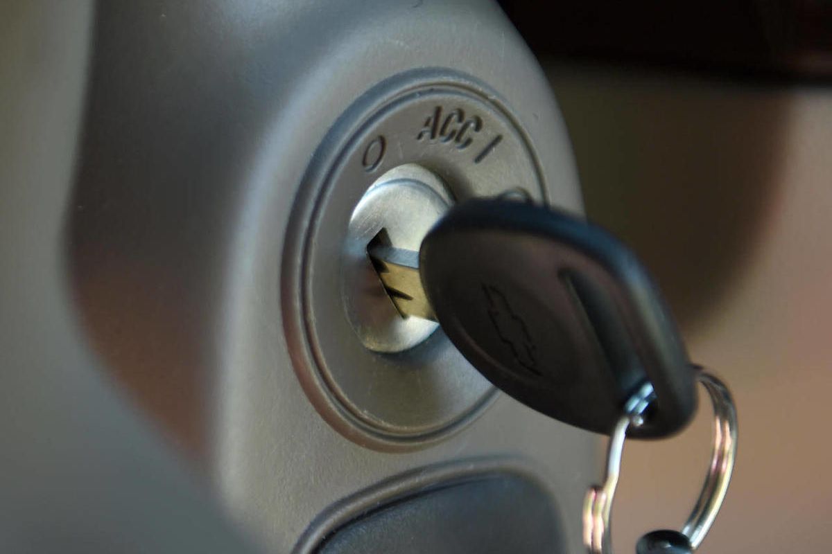 This Tuesday, April 1, 2014 file photo shows a key in the ignition switch of a 2005 Chevrolet Cobalt in Alexandria, Va. 