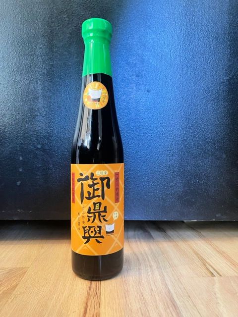 A bottle of soy sauce fermented with pineapple.