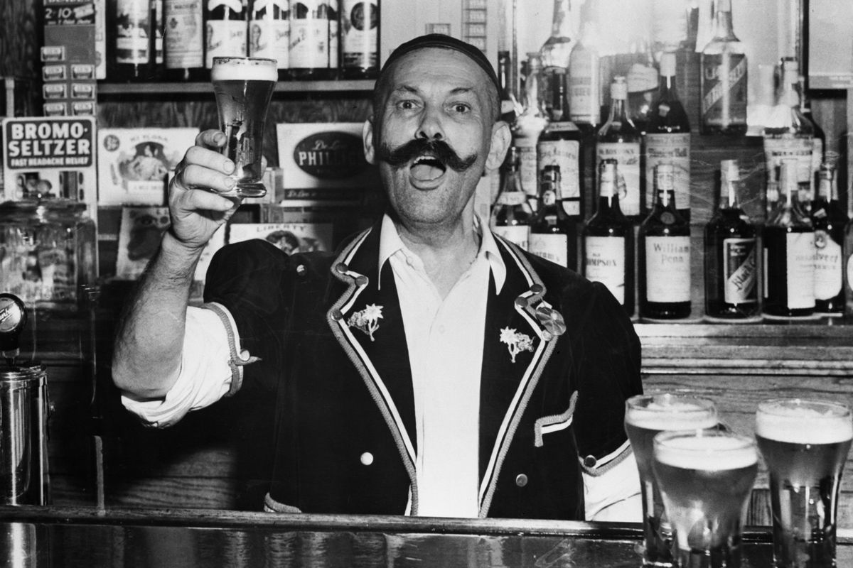 Vintage photograph of man working behind bar