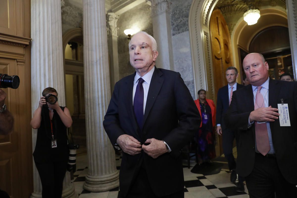 Sen. John McCain, R-Ariz., who returned to Capitol Hill after being diagnosed with an aggressive type of brain cancer, leaves the chamber after vote the Republican-run Senate rejected a GOP proposal to scuttle President Barack Obama's health care law, Wed