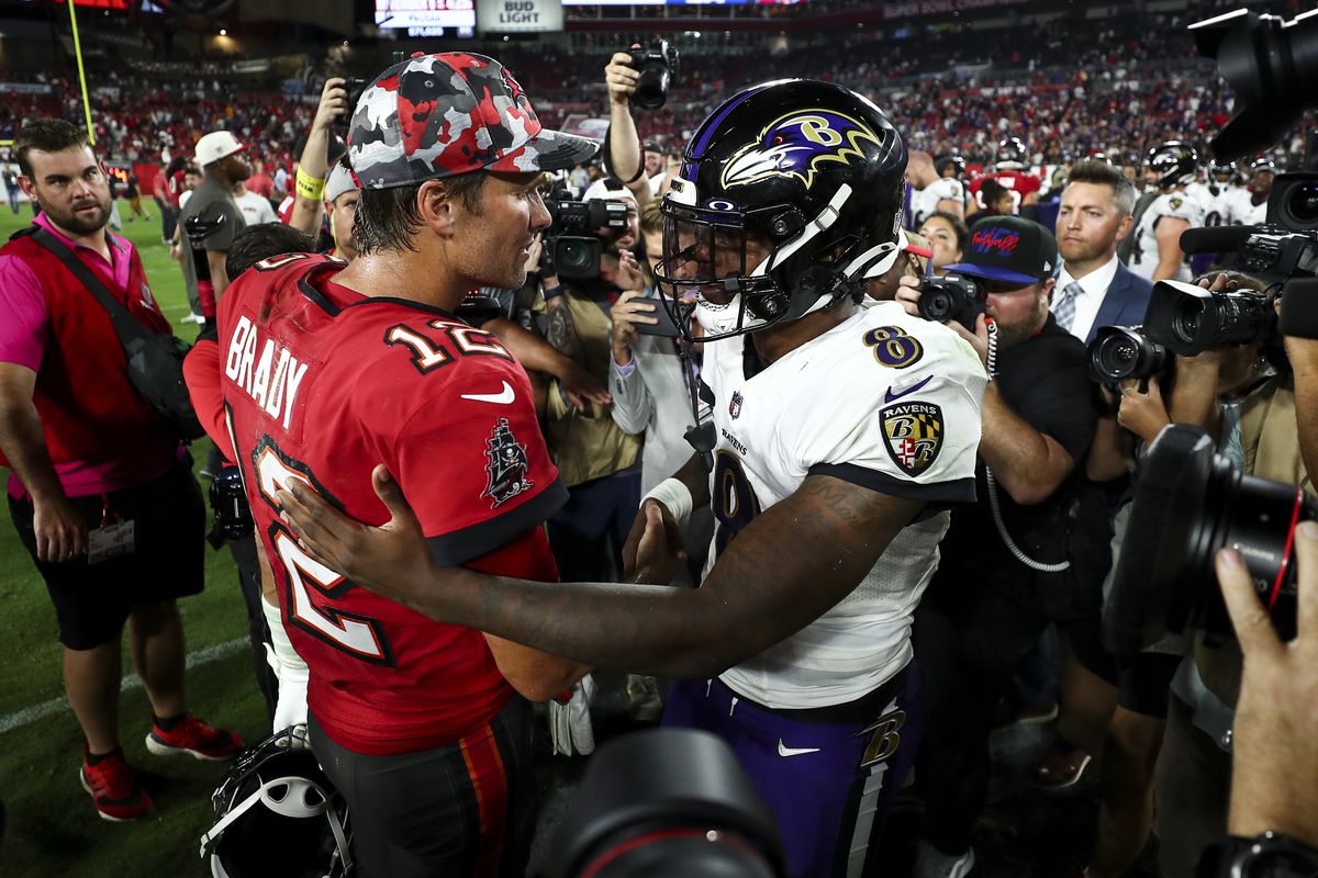 Tom Brady #12 of the Tampa Bay Buccaneers talks with Lamar Jackson #8 of the Baltimore Ravens after an NFL football game at Raymond James Stadium on October 27, 2022 in Tampa, Florida.