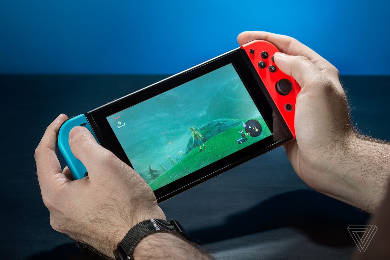 Someone playing The Legend of Zelda: Breath of the Wild on a Nintendo Switch handheld console.