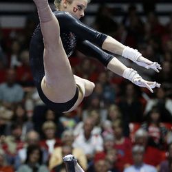 Breanna Hughes of Utah performs on the bars during NCAA gymnastics against Georgia in Salt Lake City, Saturday, March 12, 2016.