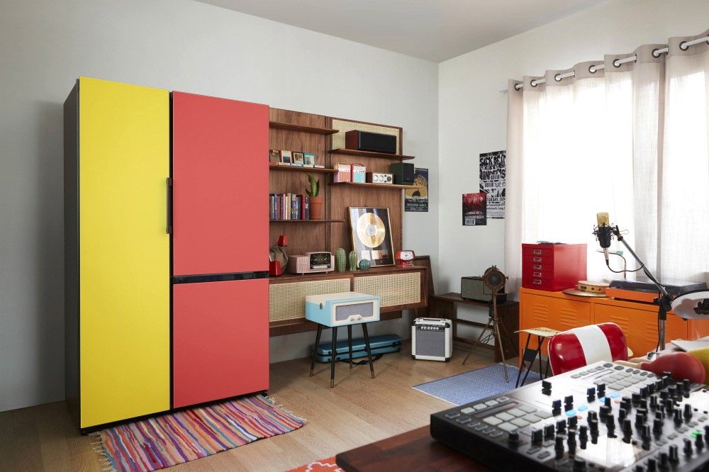 Red and yellow fridge in room