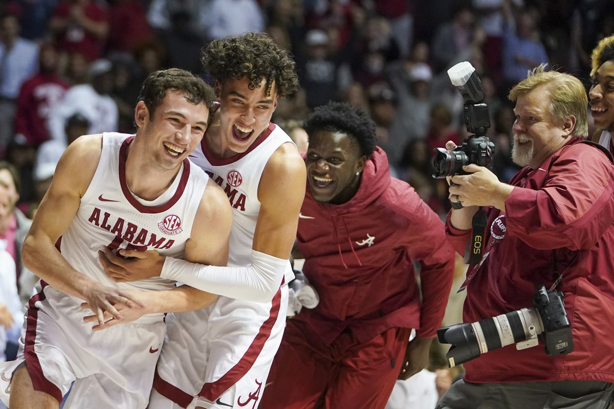 Alabama Crimson Tide forward Tyler Barnes celebrates with Alabama Crimson Tide guard Jusaun Holt after Barnes hit a goal at the buzzer after coming off the bench in the closing minutes of the game against Louisiana Tech Bulldogs at Coleman Coliseum.&nbsp;