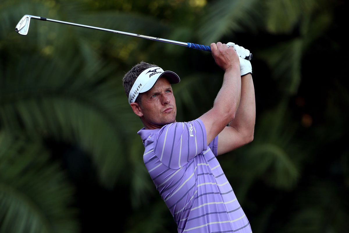 The best I could do here is a picture of Luke Donald wearing purple. NOTE: Luke Donald is not a woman.