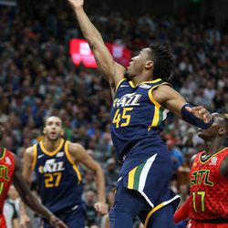 Utah Jazz guard Donovan Mitchell (45) lays it up during the game against the Atlanta Hawks at Vivint Smart Home Arena in Salt Lake City on Tuesday, March 20, 2018.