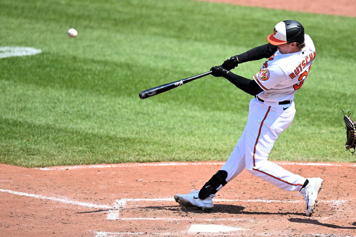 Adley Rutschman of the Baltimore Orioles hits a two-run home run in the seventh inning against the Los Angeles Angels at Oriole Park at Camden Yards on May 18, 2023 in Baltimore, Maryland.