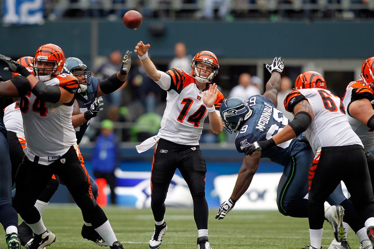 SEATTLE - OCTOBER 30:  Quarterback Andy Dalton #14 of the Cincinnati Bengals throws a pass against the Seattle Seahawks on October 30, 2011 at Century Link Field in Seattle, Washington.  (Photo by Jonathan Ferrey/Getty Images)
