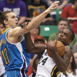 Utah's Paul Millsap grabs a rebound as he battles with Lou Amundson as the Utah Jazz and the New Orleans Hornets play Friday, April 5, 2013 at EnergySolutions Arena in Salt Lake City. Utah won 95-83.