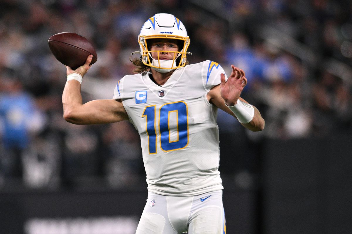 Los Angeles Chargers quarterback Justin Herbert (10) throws a pass for a touchdown against the Las Vegas Raiders during the first half at Allegiant Stadium.