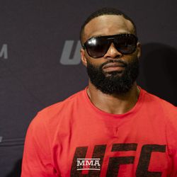 Tyron Woodley answers a question at UFC 228 media day.
