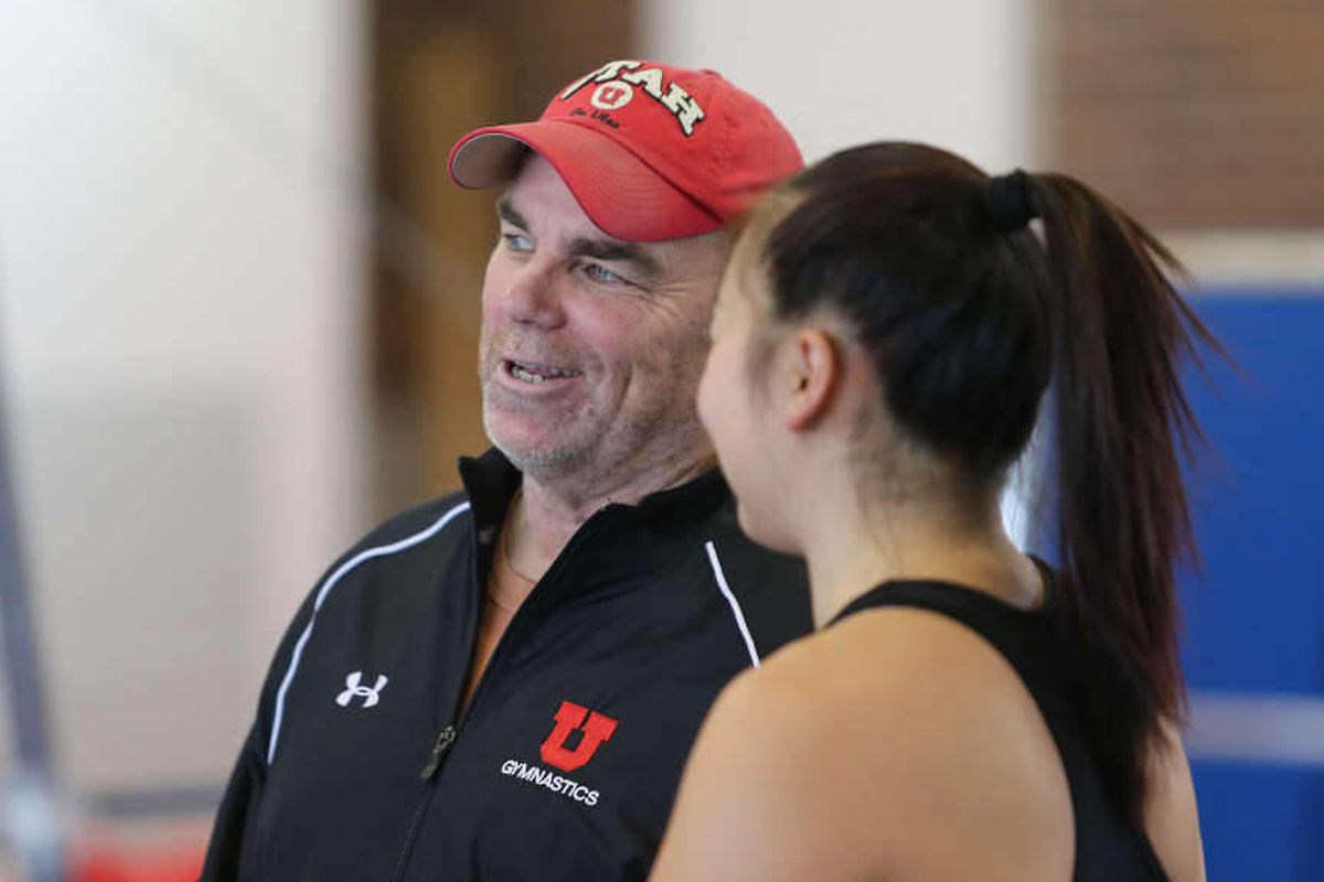 Greg Marsden, long time gymnastic coach at the University of Utah talks with Corrie Lothrop during practice, he is closing in on his 1000th victory  Tuesday, Jan. 28, 2014, in Salt Lake City.  