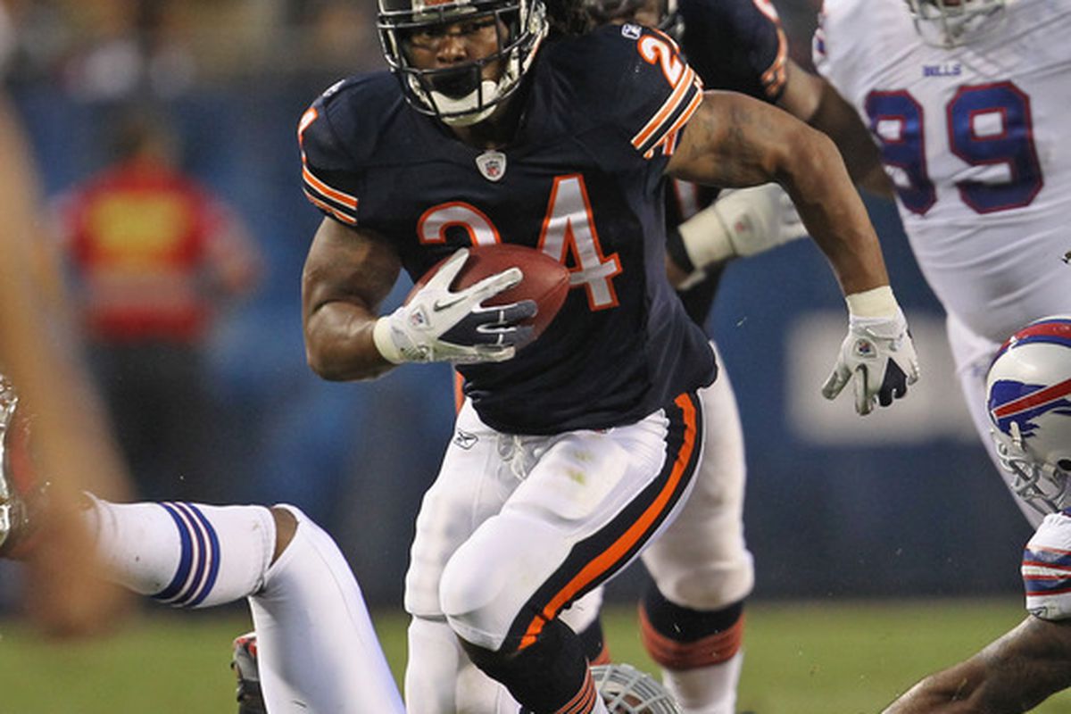 CHICAGO, IL - AUGUST 13:  Marion Barber #24 of the Chicago Bears runs for yardage against the Buffalo Bills close in during a preseason game at Soldier Field on August 13, 2011 in Chicago, Illinois.  (Photo by Jonathan Daniel/Getty Images)