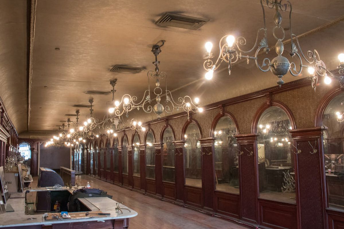 Chandeliers and mirrored walls inside Gage &amp; Tollner