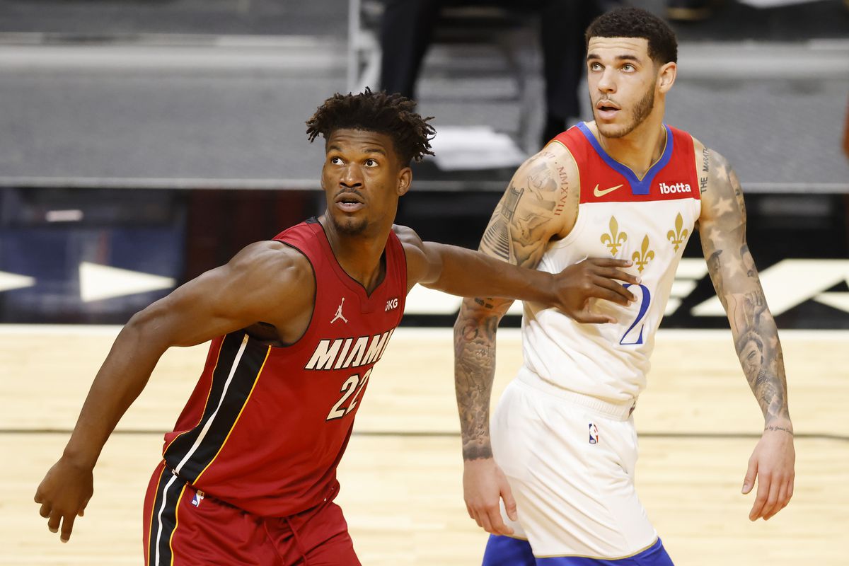 Jimmy Butler of the Miami Heat defends Lonzo Ball of the New Orleans Pelicans during the second quarter at American Airlines Arena on December 25, 2020 in Miami, Florida.