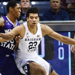 Brigham Young Cougars forward Yoeli Childs (23) goes to work on Weber State Wildcats forward Kyndahl Hill (35) as BYU and Weber State play at the Marriott Center in Provo on Wednesday, Dec. 7, 2016.