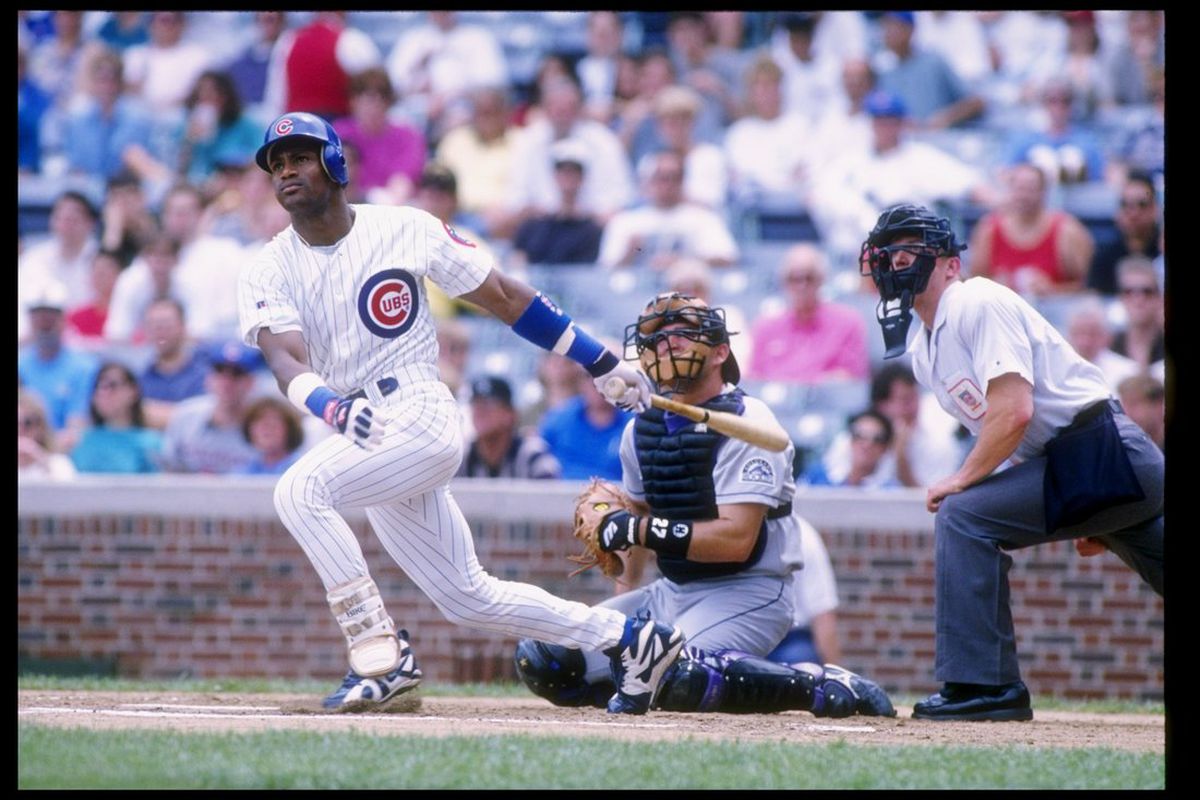 Right fielder Sammy Sosa of the Chicago Cubs swings at the ball during a game at Wrigley Field in Chicago, Illinois. (Jonathan Daniel/Getty Images
