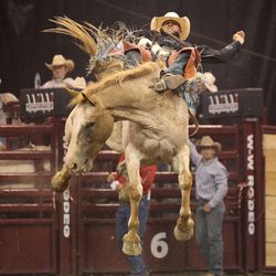Brian Bain rides in the bareback competition during the final day of the Days of '47 Rodeo at Energy Solutions Arena on July 26.