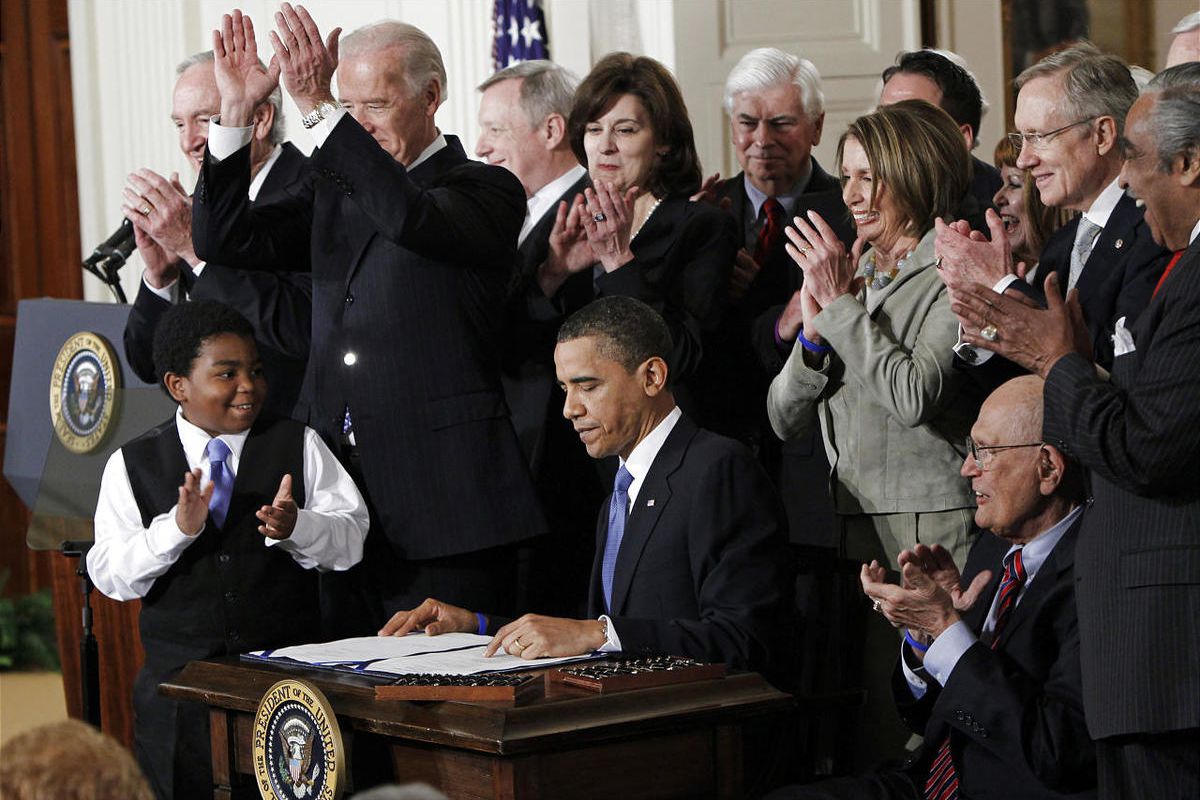 President Barack Obama is applauded after signing the Affordable Care Act into law in the East Room of the White House in Washington back in March of 2010. 