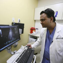 Dr. Amit Patel takes a look at a ultrasound of a heart at University Hospital on Monday, June 9, 2014, in Salt Lake City.