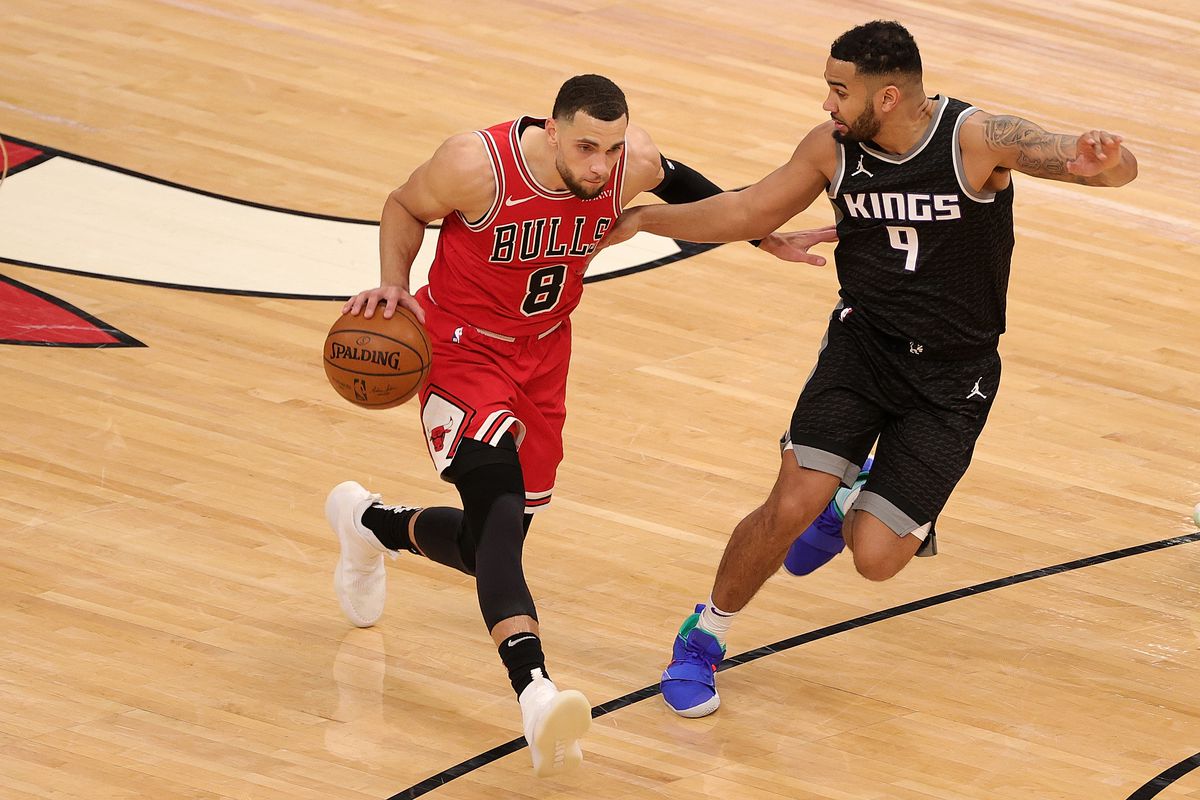 Zach LaVine of the Chicago Bulls is defended by Cory Joseph of the Sacramento Kings during the first half of a game at United Center on February 20, 2021 in Chicago, Illinois.&nbsp;