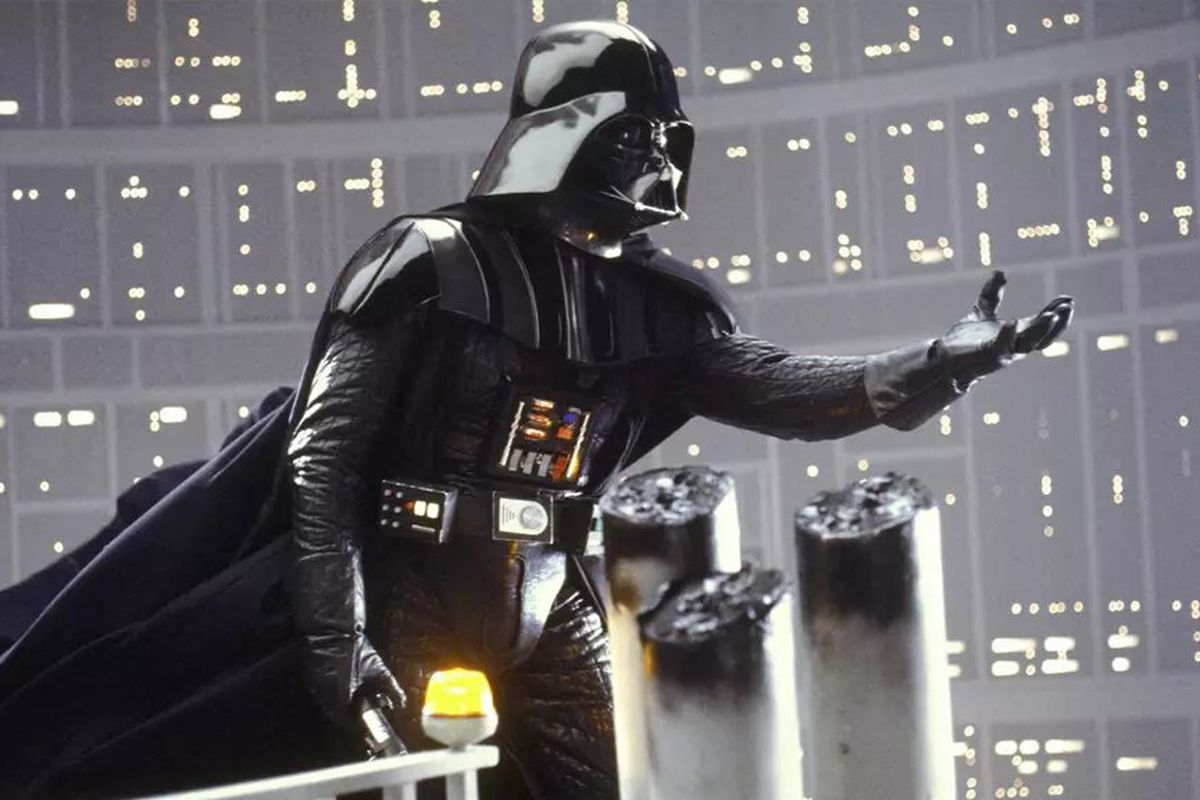 Darth Vader reaching his hand out across a balcony in Star Wars: The Empire Strikes Back