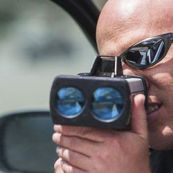 While on patrol, Utah Highway Patrol trooper Jarod Babcock checks for speeders on the roads of Salt Lake City on Thursday, May 26, 2016. Babcock is preparing for the 100 Deadliest Days on the road starting Memorial Day.