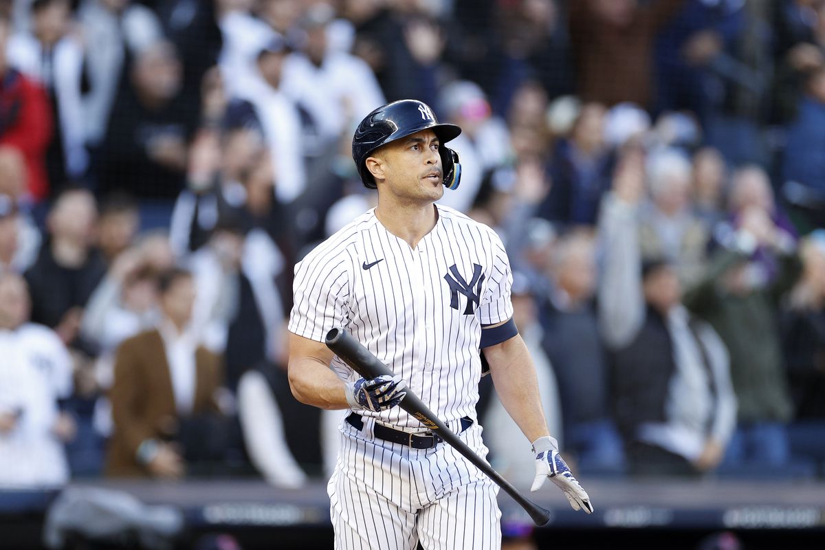 Giancarlo Stanton of the New York Yankees watches his three-run home run against the Cleveland Guardians during the first inning in game five of the American League Division Series at Yankee Stadium on October 18, 2022 in New York, New York.
