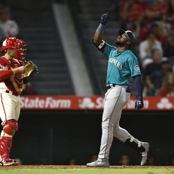 ANAHEIM, CALIFORNIA - SEPTEMBER 17: Taylor Trammell #20 of the Seattle Mariners celebrates as he heads home after hitting a one-run home run against the Los Angeles Angels during the eighth inning at Angel Stadium of Anaheim on September 17, 2022 in Anaheim, California.