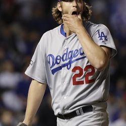 FILE - In this Oct. 22, 2016, file photo, Los Angeles Dodgers starting pitcher Clayton Kershaw (22) walks back to the dugout after pitching the fourth inning of Game 6 of the National League baseball championship series against the Chicago Cubs, in Chicago. Kershaw entered October looking to put a history of playoff failures behind him. The three-time Cy Young Award winner pitched on short rest whenever needed and went 2-1 with a huge save, but was far from overwhelming. 
