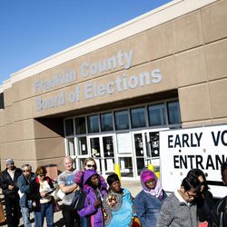 A line of early voters waits outside the Franklin County Board of Elections, Monday, Nov. 7, 2016, in Columbus, Ohio. Heavy turnout has caused long lines as voters take advantage of their last opportunity to vote before election day. 