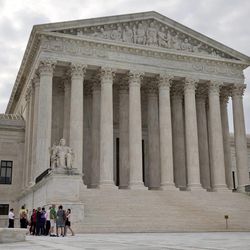 People begin to enter the Supreme Court in Washington, Friday June 26, 2015.  