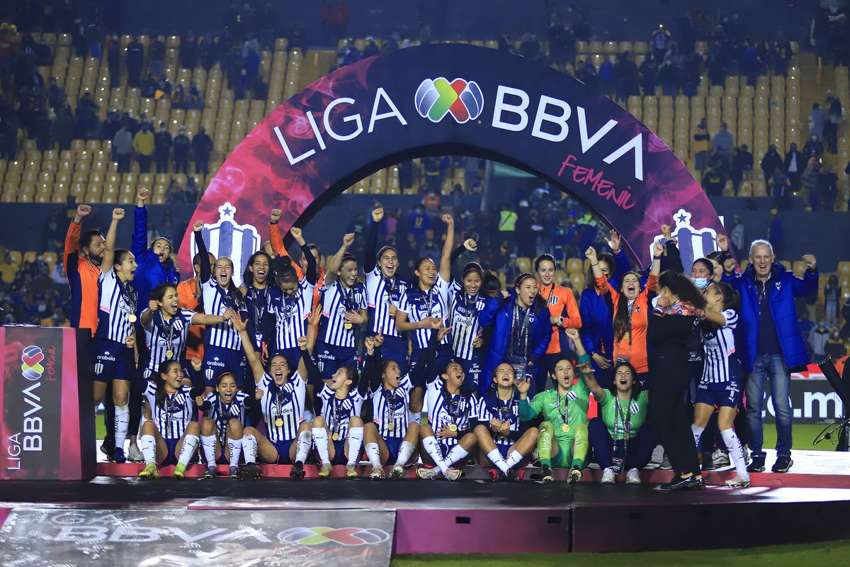 Players of Monterrey celebrate with the championship trophy during the final second leg match between Tigres UANL and Monterrey as part of the Torneo Grita Mexico A21 Liga MX Femenil at Universitario Stadium on December 20, 2021 in Monterrey, Mexico.