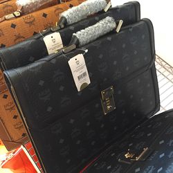 Men's briefcase, $587 (was $1,175)