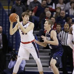 Gonzaga's Kyle Wiltjer, left, posts up against BYU's Kyle Davis during the first half of an NCAA college basketball game, Thursday, Jan. 14, 2016, in Spokane, Wash. (AP Photo/Young Kwak)