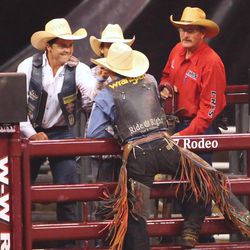 Milford Utah's Rusty Wright, is congratulated after his Saddle Bronc ride on Kool Toddy, and scoring 90 points in the final night of competition Saturday, July 25, 2015, of the Days of 47 Rodeo at EnergySolutions Arena in Salt Lake City.