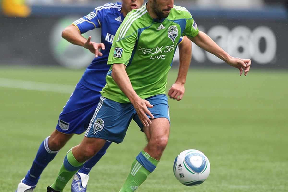 SEATTLE - APRIL 17:  Peter Vagenas #8 of the Seattle Sounders FC battles Davy Arnaud #22 of the Kansas City Wizards on April 17, 2010 at Qwest Field in Seattle, Washington. The Sounders defeated the Wizards 1-0. (Photo by Otto Greule Jr/Getty Images)