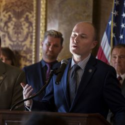 Rep. Steve Eliason, R-Sandy, left, Troy Williams, executive director of Equlity Utah, and Gov. Gary Herbert, right, listen as Lt. Gov. Spencer Cox, center, speaks at a press conference announcing the formation of a Youth Suicide Prevention Task Force at the Capitol in Salt Lake City on Wednesday, Jan. 17, 2018.