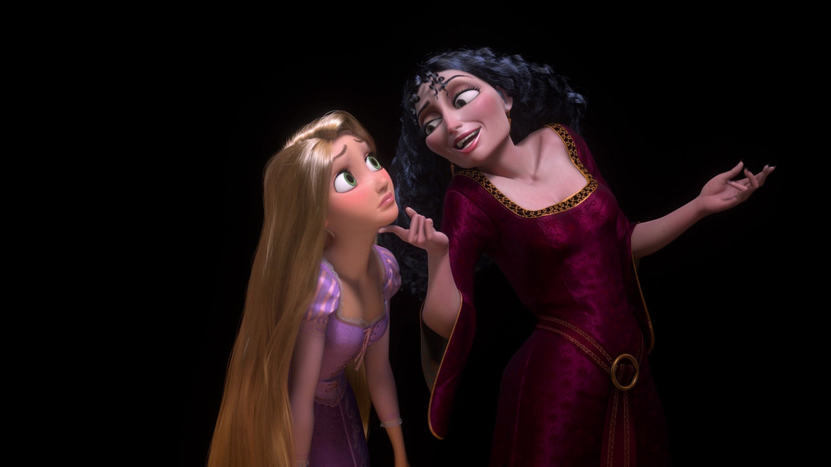 mother gothel with a finger under rapunzel’s chin 