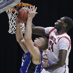 Louisville forward Montrezl Harrell (24) blocks a shot by Duke forward Mason Plumlee during the first half of the Midwest Regional final in the NCAA college basketball tournament, Sunday, March 31, 2013, in Indianapolis. 