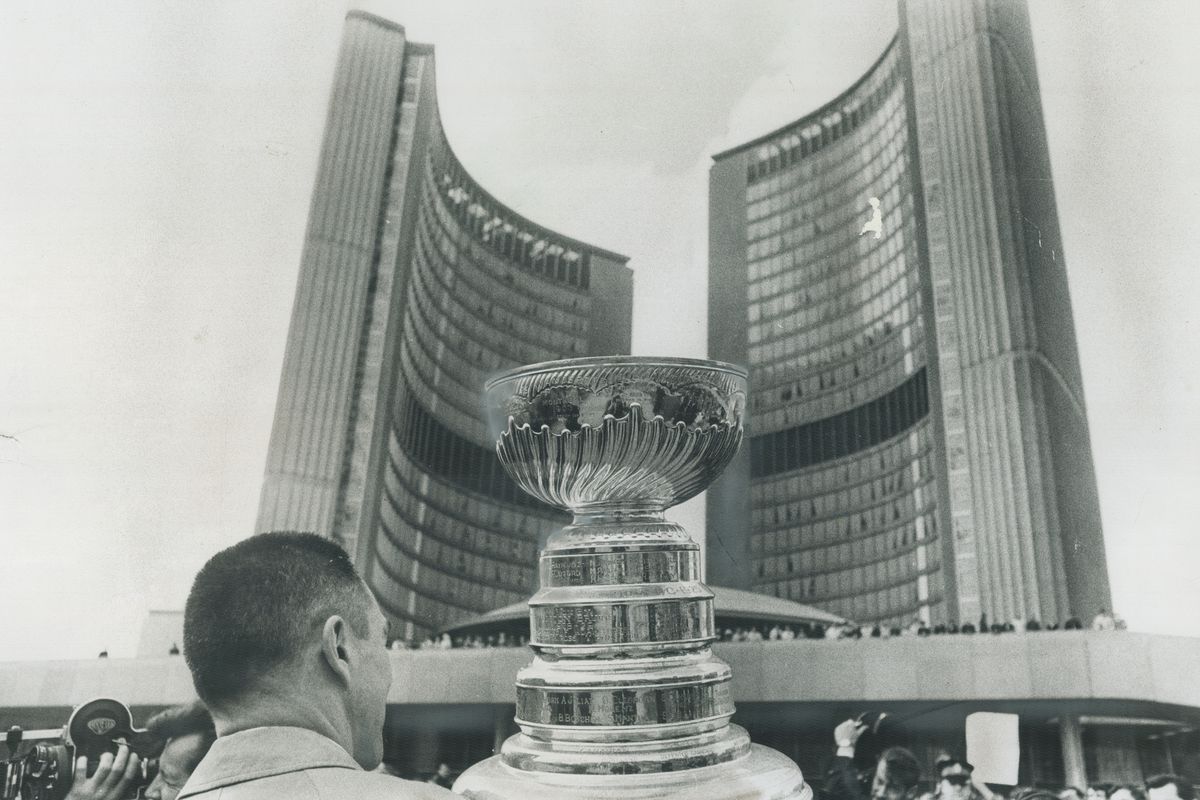 Toronto honors its maple leafs. Maple Leaf Captain George Armstrong (top) holds the Stanley Cup and