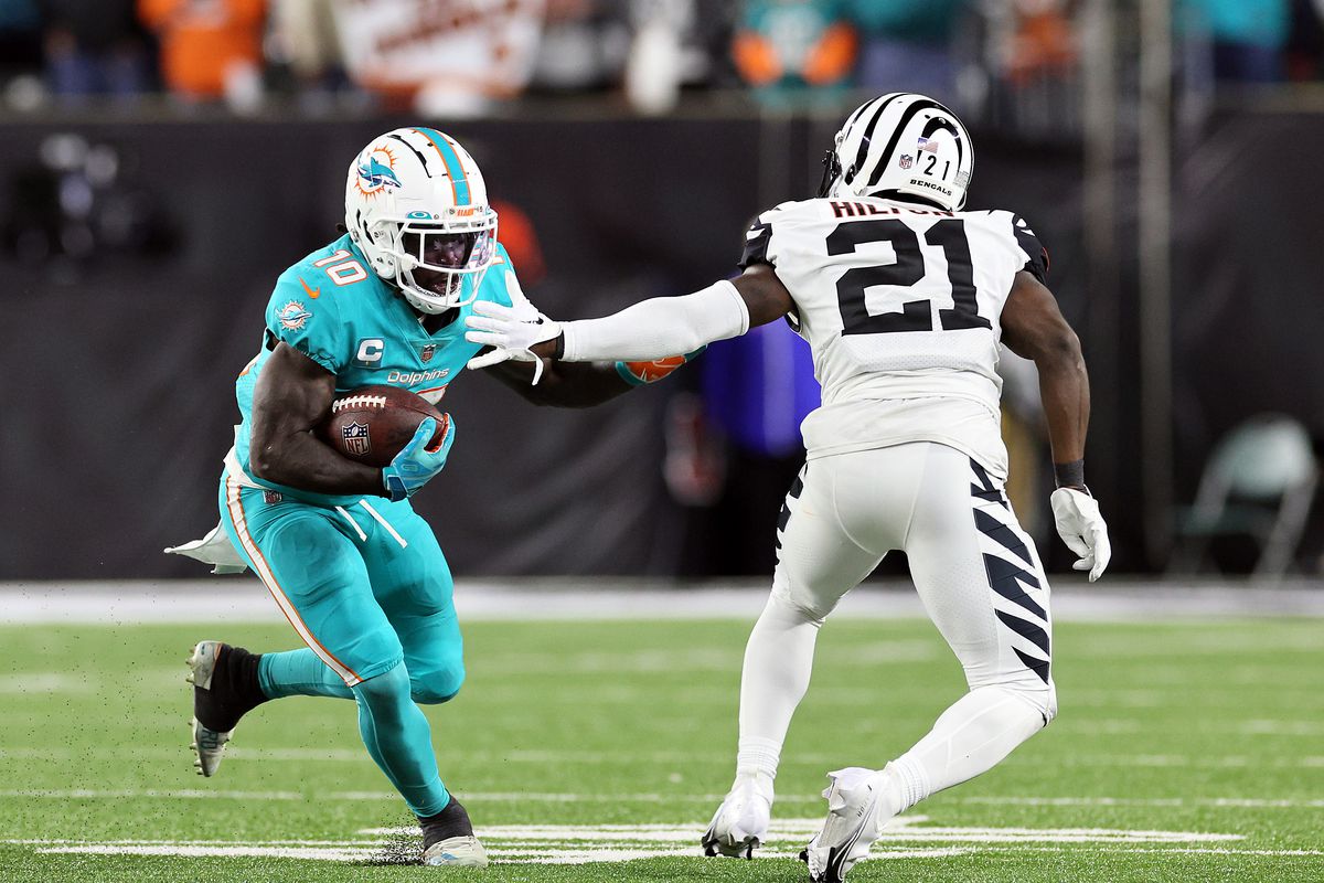 Miami Dolphins v Cincinnati Bengals Wide receiver Tyreek Hill #10 of the Miami Dolphins carries the ball after making a catch as cornerback Mike Hilton #21 of the Cincinnati Bengals defends during the 2nd half of the game at Paycor Stadium on September 29, 2022 in Cincinnati, Ohio.