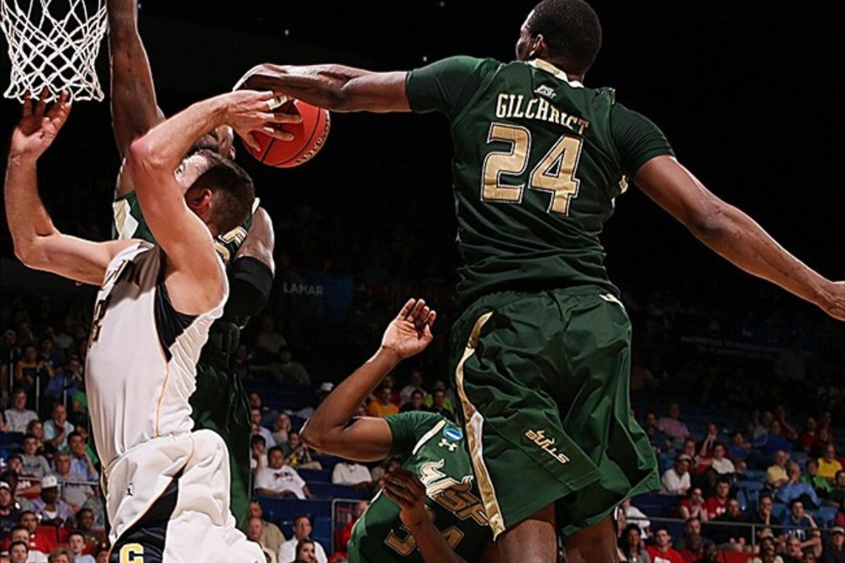 California Bears forward Harper Kamp has his shot blocked by South Florida Bulls forward Augustus Gilchrist during the first round of the 2012 NCAA men's basketball tournament at Dayton Arena. USF defeated Cal 65-54 (Brian Spurlock-US PRESSWIRE).