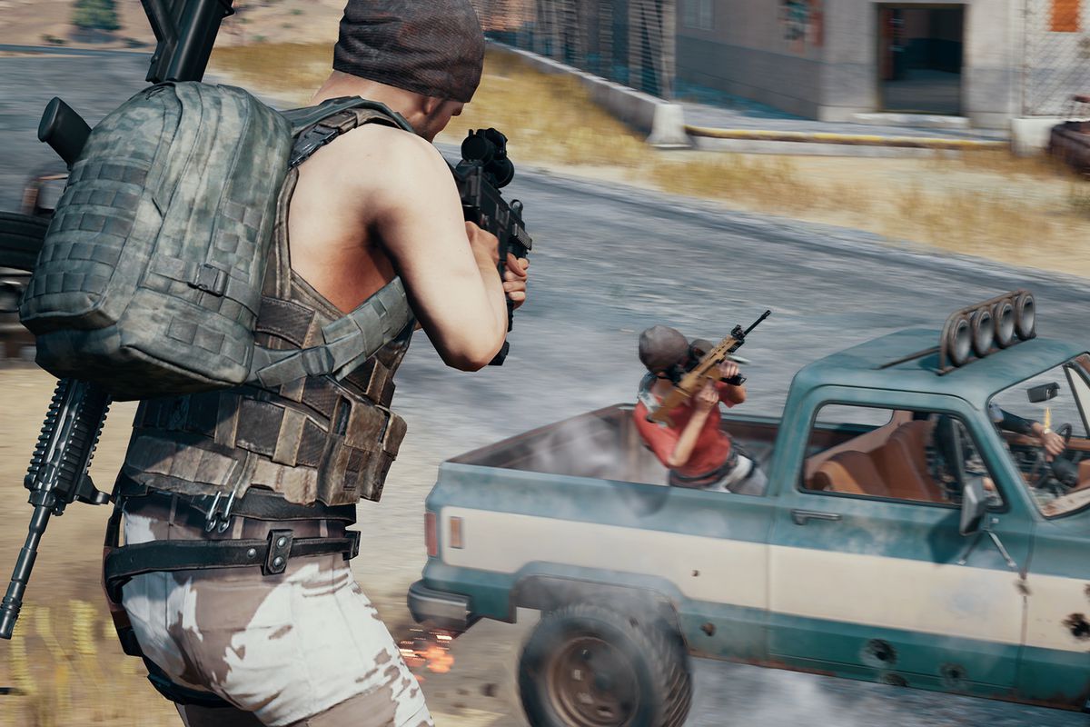 PlayerUnknown’s Battlegrounds - a player fires into the bed of a truck from an elevated position