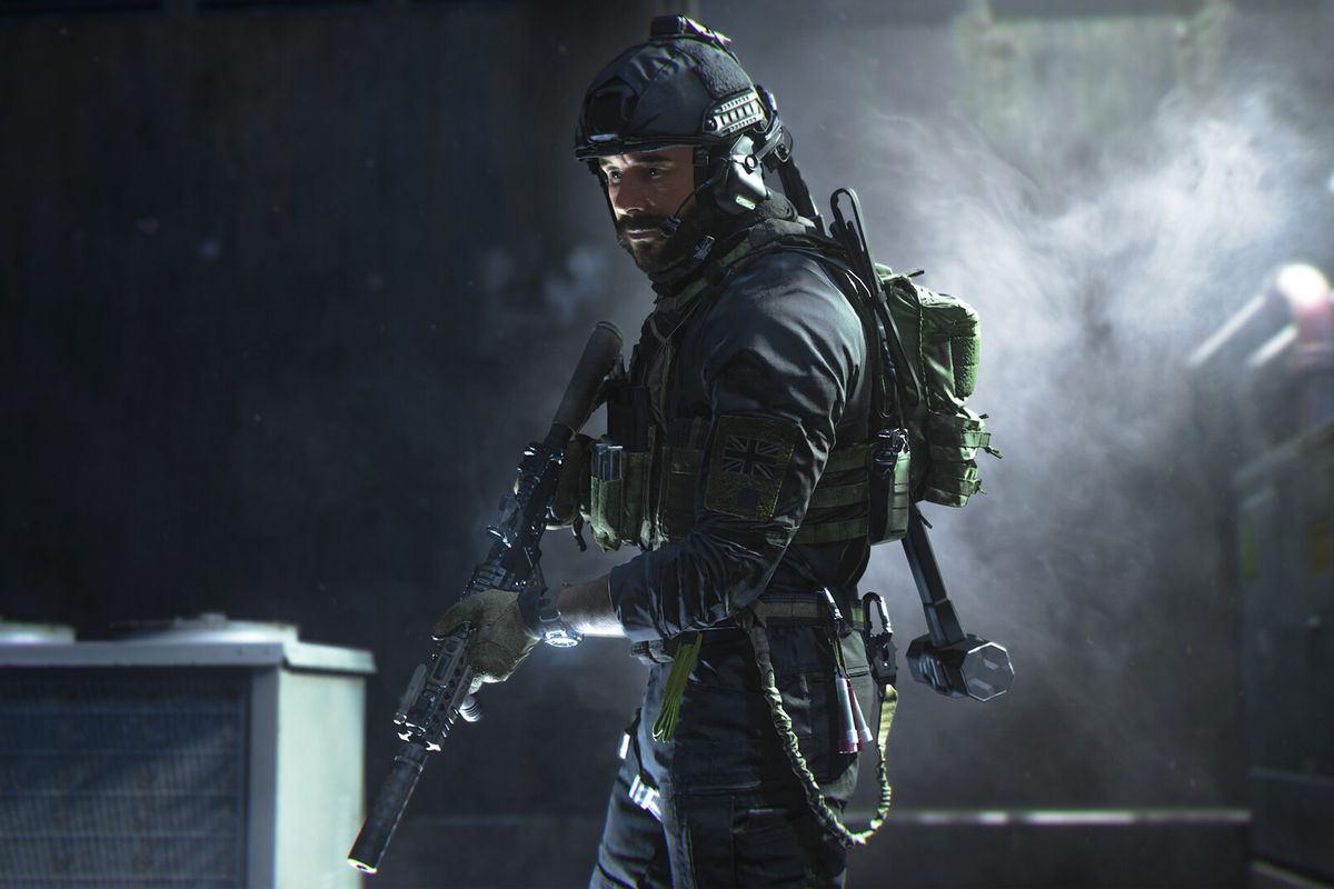 An image of a soldier in Call of Duty: Morden Warfare 2. The soldier is holding a gun as he carefully walks through a dark and smokey room. 