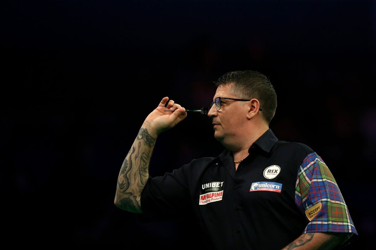 Gary Anderson throws a dart in his match against Nathan Aspinall during Night Six of the Premier League Darts at the M&amp;S Bank Arena on March 12, 2020 in Liverpool, England.