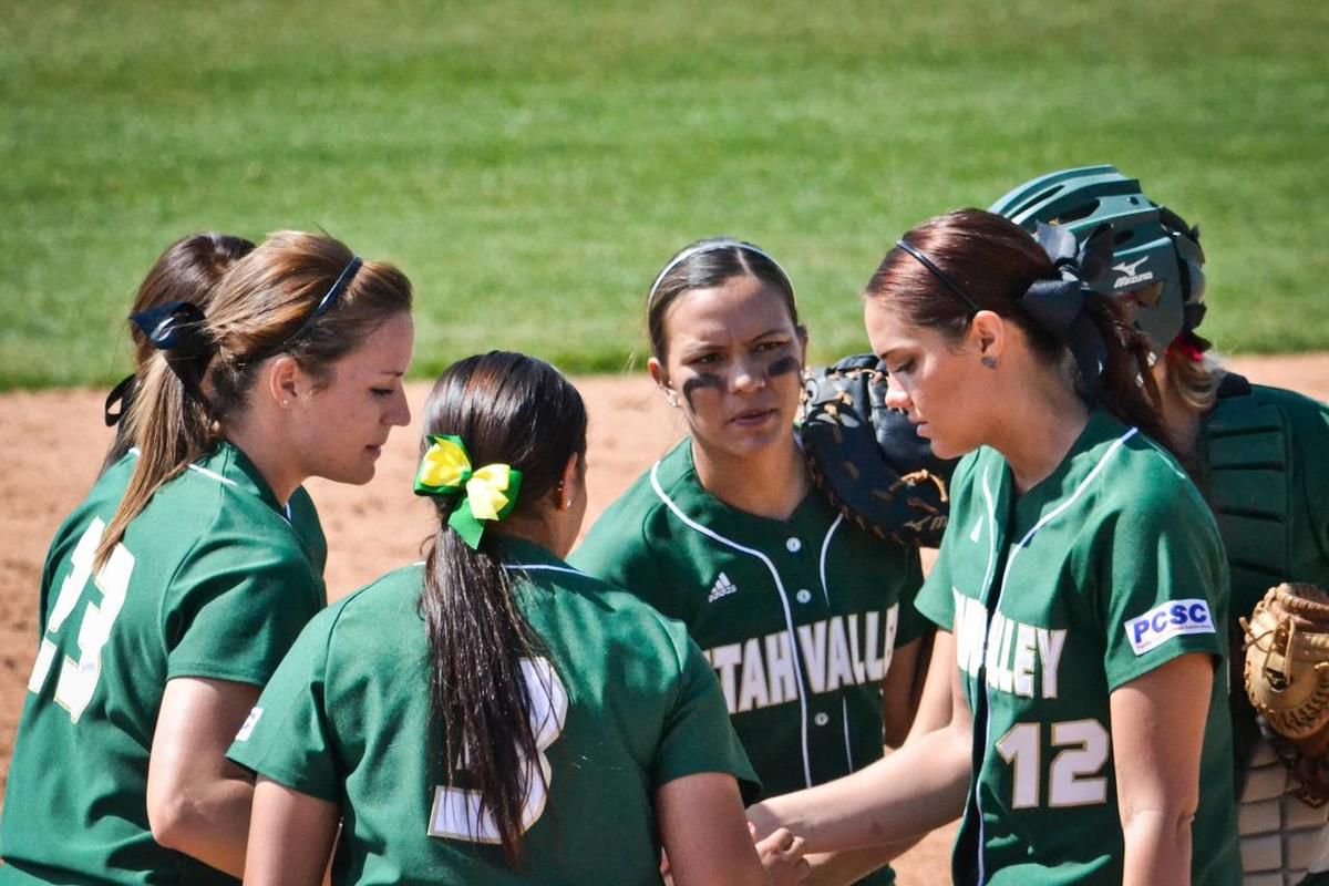 The UVU softball team huddles together before the start of an inning against CSU Bakersfield at Wolverine Field on March 30.