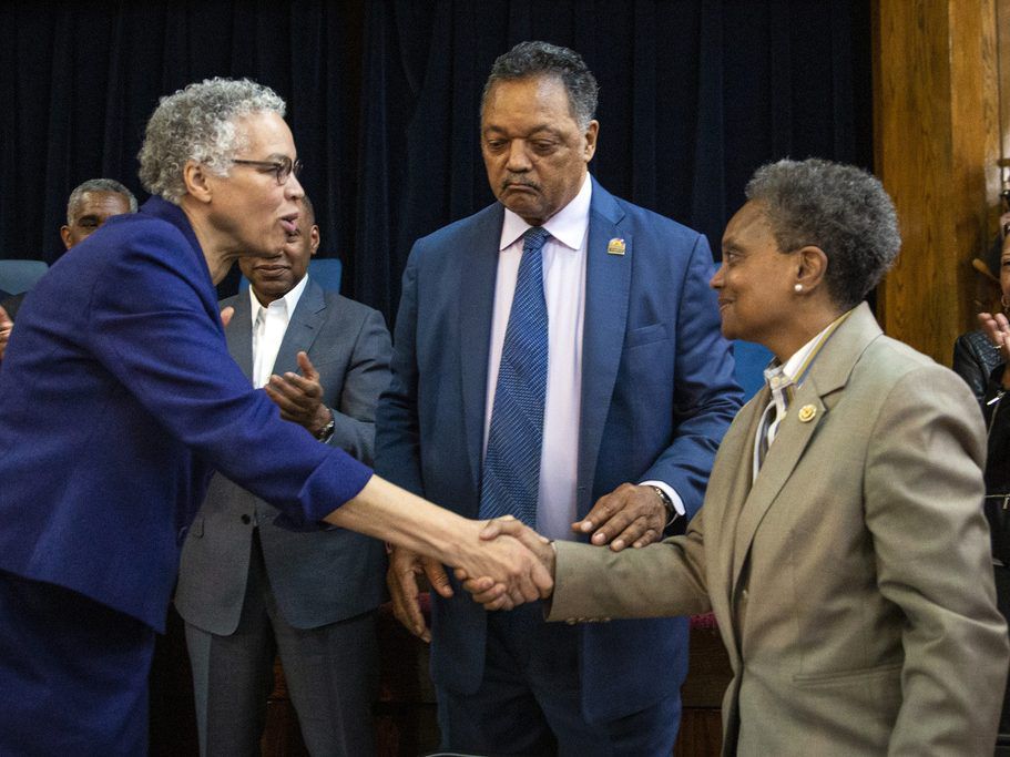 Chicago Mayor-elect Lori Lightfoot, right, shakes hands with Cook County Board President Toni Preckwinkle as Rev. Jesse Jackson looks on during a press conference at the Rainbow PUSH organization Wednesday. (Ashlee Rezin/Chicago Sun-Times)